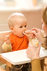 Image showing Feeding a little baby boy