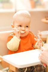 Image showing Baby boy playing with spoon