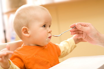 Image showing Feeding a little baby boy