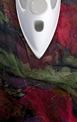 Image showing Ironing colorful delicate silk