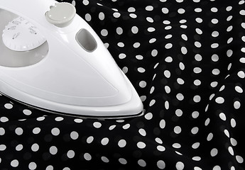 Image showing Ironing delicate polka fabric