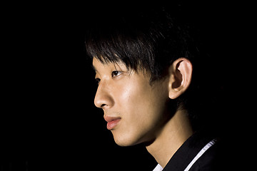 Image showing Portrait of an Asian man in the darkness 