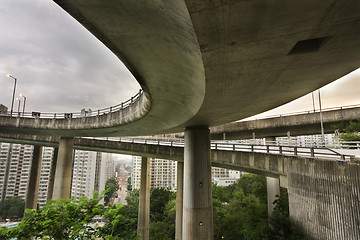 Image showing Modern urban city with freeway traffic bridge at day