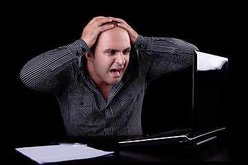 Image showing businessman  surprised looking to computer