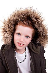 Image showing Cute boy with a furry hood