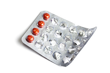 Image showing Red pills isolated on white