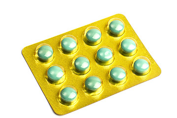 Image showing Package of green pills isolated on white