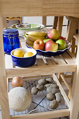 Image showing Kitchen Island with fruits, lemon, potatos, onion on the shelf