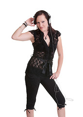 Image showing young woman listening headphones