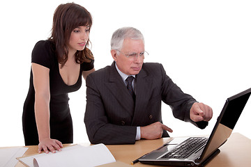 Image showing businessman and woman discussing, because of work, pointing to computer