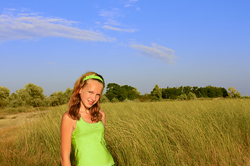 Image showing Teenage girl among the high grass