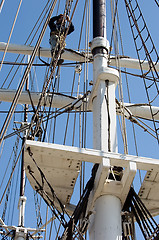 Image showing Climbing up a mast.