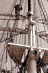 Image showing Climbing up a mast. Sepia