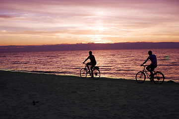 Image showing Bicyclists on the beach