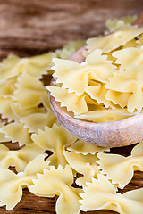 Image showing uncooked pasta in wooden spoon 