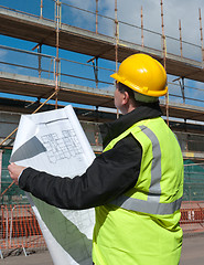 Image showing Builder inspects construction site.