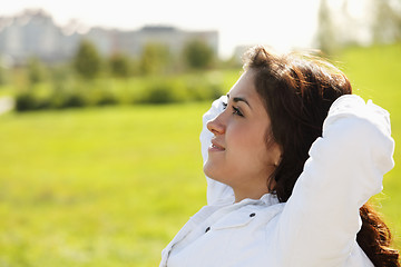 Image showing Young woman with hands behing head