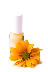 Image showing yellow nail polish and flower