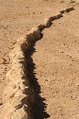 Image showing Curved wall of ancient fortress ruin in the desert