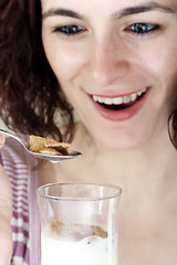 Image showing Young people eating milk with cereals