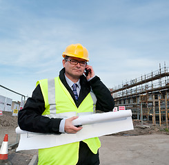 Image showing Architect on building site phoning