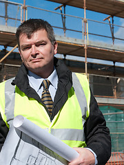 Image showing Smiling, confident architect looks at camera