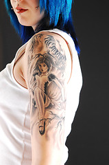 Image showing Girl with girl tattoo.