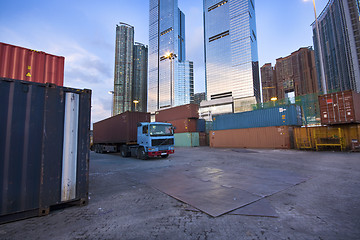 Image showing container site before modern building 