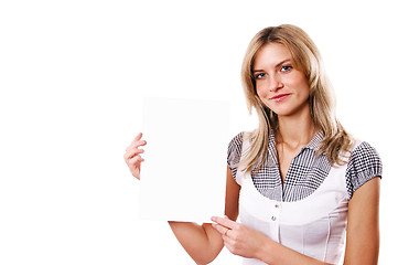 Image showing The young woman holds a leaf of a pure paper