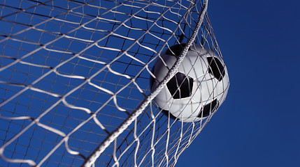 Image showing Soccer ball kicked into a goal