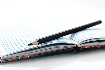 Image showing close up of notebook and pencil