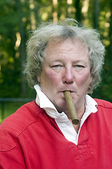 Image showing senior man smoking big cigar