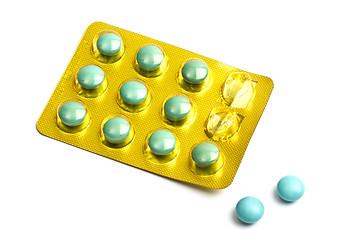 Image showing Set of green pills isolated on white 