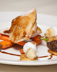 Image showing Roast chicken dish with haggis