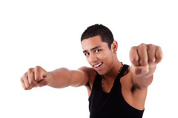 Image showing Portrait of a very happy  young latin man with his arms raised