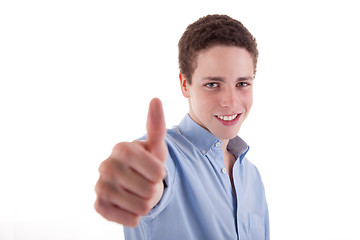 Image showing young man smiling, with thumb up