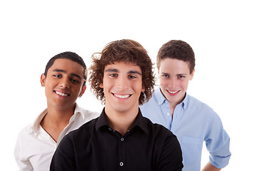 Image showing one boy, with two friends on back, of different colors,looking to camera and smiling