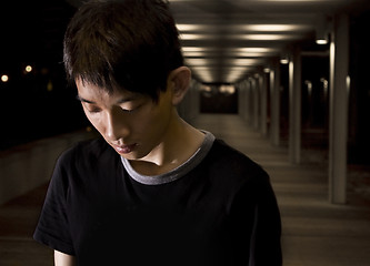 Image showing Portrait of an Asian man in the darkness