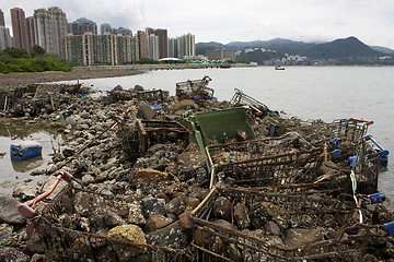 Image showing Garbage piled up on the coast of the ocean. 