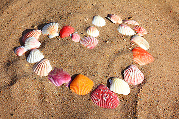 Image showing heart symbol from shells on sand