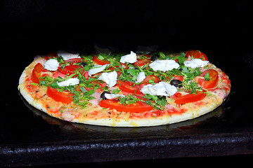 Image showing pizza in oven