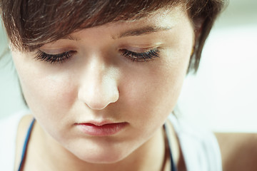 Image showing Brunette looking down closeup