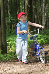 Image showing Boy with bicycle