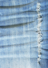 Image showing Worn out wrinkled blue denim