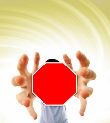 Image showing Man grabing a red sign.