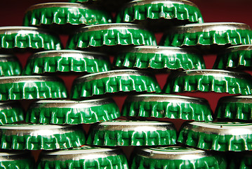 Image showing pile of green beer caps