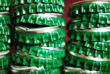 Image showing pile of green beer caps