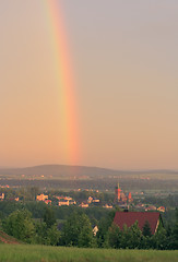 Image showing Rainbow over village