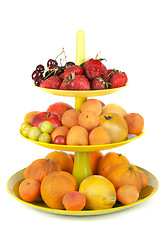 Image showing Fruits in green vase insulated on white background