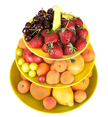 Image showing Fruits in green vase insulated on white background